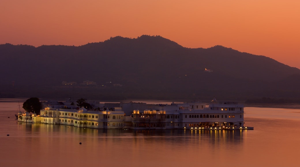 Lake Palace showing a coastal town, a sunset and general coastal views