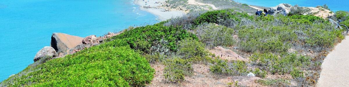 Park your car in the parking spaces of San Giovanni , and buy the ticket that will give you entrance to 3 archeological sites.. Once you've visited the ruins of Tharros , and the Aragonese tower, you still have a small way to go to fully appreciate the beauty of this fine Sinis Peninsula ..Bring some water with you, get on the small touristic train or follow by foot the easy if a little steep road to San Marco lighthouse ..this will allow you to enjoy the view of some rocky cliffs with pray birds , to smell the mediterranean shrubs , and to see some more ruins in the process of being mapped..coming back, you'll have the "Mare morto" ( dead sea, always very calm ) and some big marshes on your right, while the "Mare vivo " ( alive) and the ancient holiday village of San Giovanni are on your left.This peninsula has been inhabited since prehistoric times, and right behind the peninsula archeologists have discovered seeds of melons and grapes, 3000 years old!!
Rub off your sweat with a nice swim in the long sandy beach,and keep two hours free to visit the Cabras Museum ( no hurry, the ticket is valid for one week ) , where you'll see several unique burial objects, shipwreck findings and the famous Giant statues of Monte Prama, with the Boxeur, the Archer and other big statues being unearthed in these very weeks ..