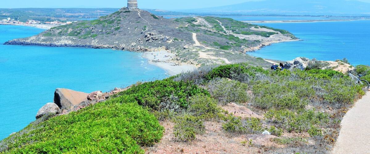 Park your car in the parking spaces of San Giovanni , and buy the ticket that will give you entrance to 3 archeological sites.. Once you've visited the ruins of Tharros , and the Aragonese tower, you still have a small way to go to fully appreciate the beauty of this fine Sinis Peninsula ..Bring some water with you, get on the small touristic train or follow by foot the easy if a little steep road to San Marco lighthouse ..this will allow you to enjoy the view of some rocky cliffs with pray birds , to smell the mediterranean shrubs , and to see some more ruins in the process of being mapped..coming back, you'll have the "Mare morto" ( dead sea, always very calm ) and some big marshes on your right, while the "Mare vivo " ( alive) and the ancient holiday village of San Giovanni are on your left.This peninsula has been inhabited since prehistoric times, and right behind the peninsula archeologists have discovered seeds of melons and grapes, 3000 years old!!
Rub off your sweat with a nice swim in the long sandy beach,and keep two hours free to visit the Cabras Museum ( no hurry, the ticket is valid for one week ) , where you'll see several unique burial objects, shipwreck findings and the famous Giant statues of Monte Prama, with the Boxeur, the Archer and other big statues being unearthed in these very weeks ..