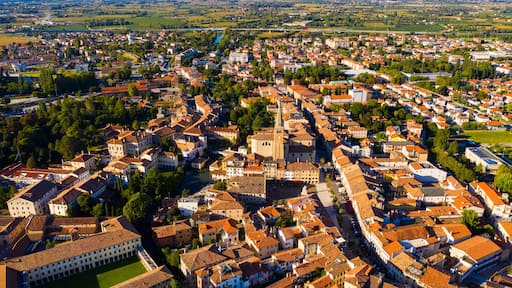 Scenic cityscape from drone of Italian town of Portogruaro in sunny day, Veneto, Italy