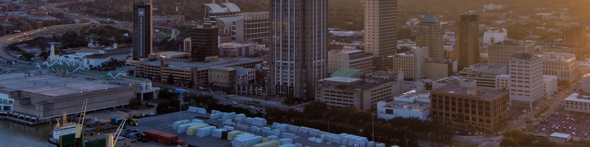 Downtown Mobile, Alabama riverside skyline at sunset