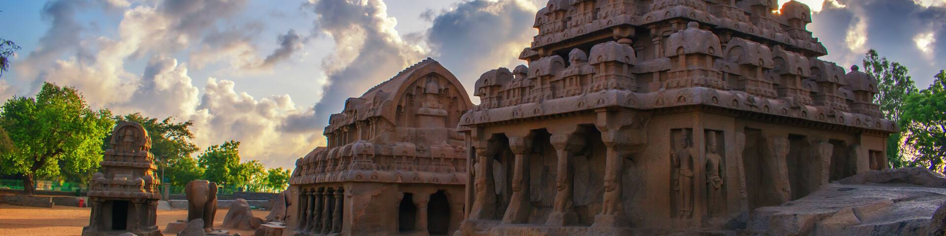 Photo shot on sunrise time where the historical buildings of Mamallapuram monuments are highlighted.