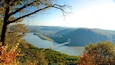 A river, a bridge, and surrounding hills.