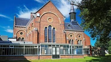 Venray (Vincent van Gogh mental hospital), Netherlands - July 9. 2023: Beautiful park with church in dutch mental psychiatric clinic