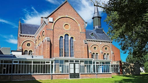 Venray (Vincent van Gogh mental hospital), Netherlands - July 9. 2023: Beautiful park with church in dutch mental psychiatric clinic