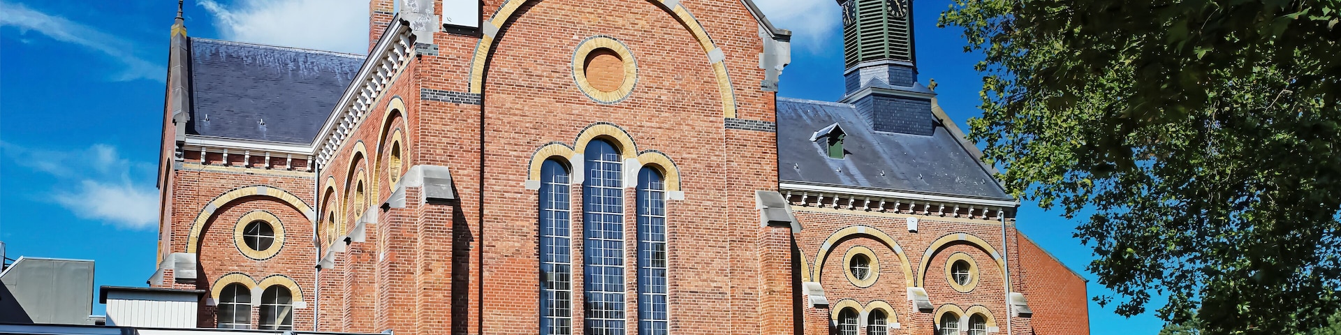 Venray (Vincent van Gogh mental hospital), Netherlands - July 9. 2023: Beautiful park with church in dutch mental psychiatric clinic