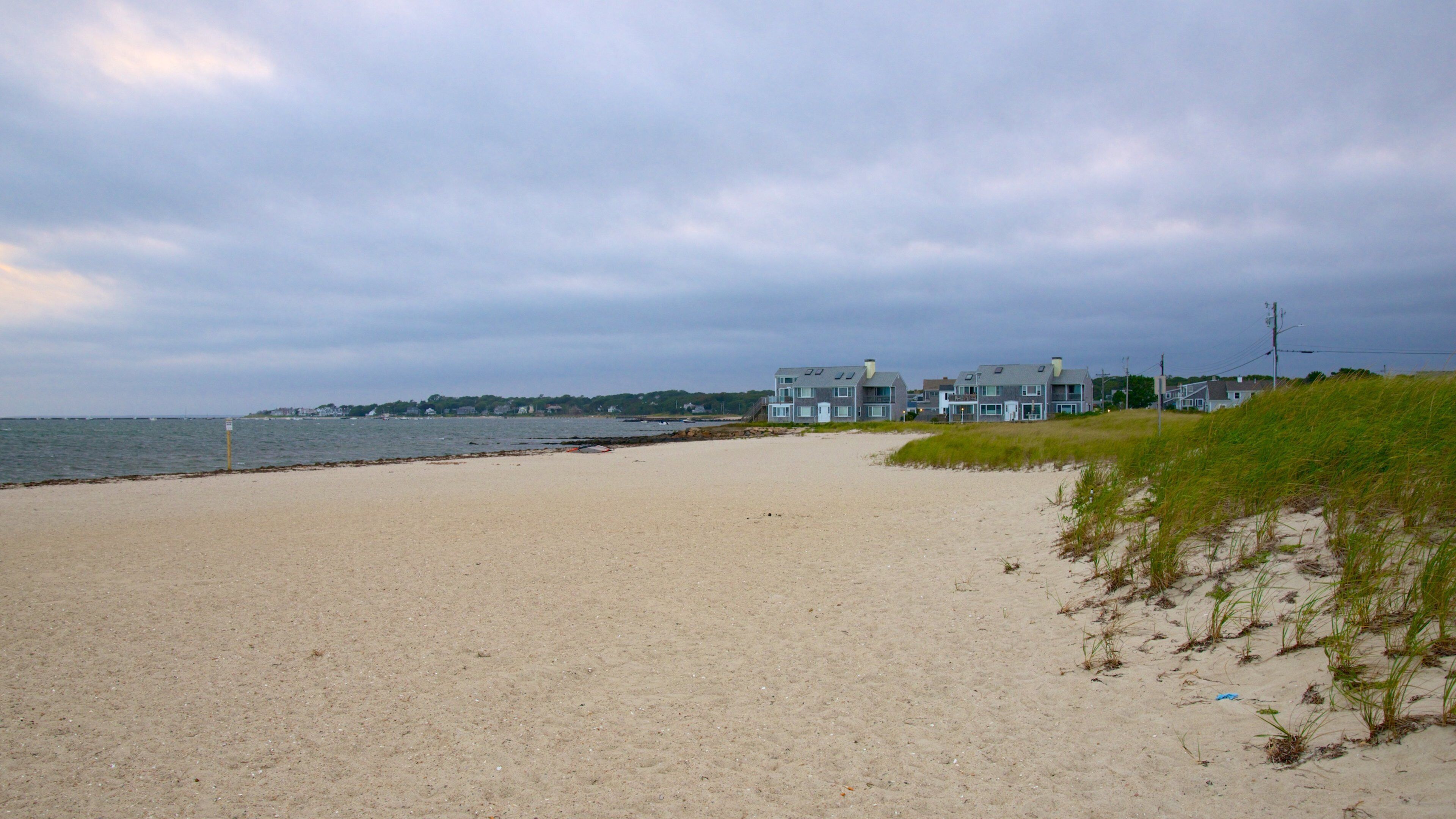 Kalmus Beach which includes a coastal town and a beach