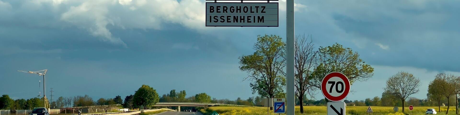 Navigational Directions at Dusk: D83 Road Sign with Cloudy Sky Near Guebwiller, Haut-Rhin, Alsace, France