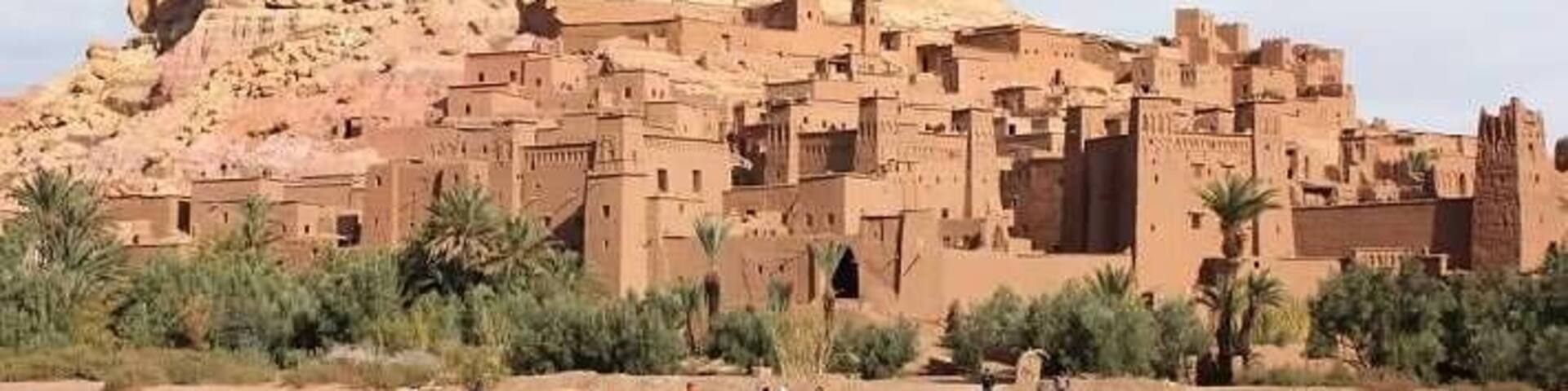 A large, ancient walled city with a prominent hilltop structure.