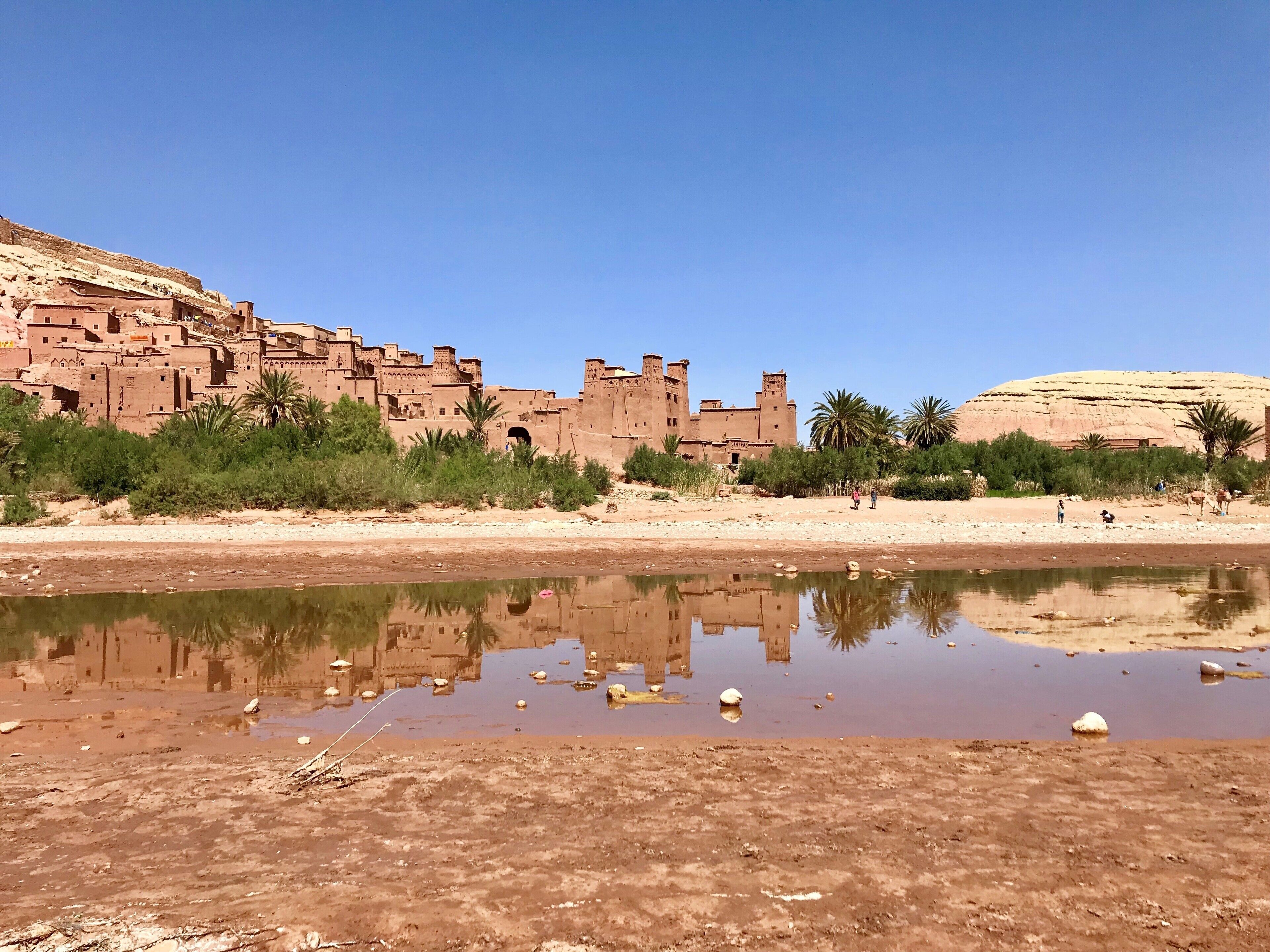 Aït Benhaddou is an ighrem (fortified village in English) along the former caravan route between the Sahara and Marrakech in present-day Morocco. Most citizens attracted by the tourist trade live in more modern dwellings in a village on the other side of the river, although there are four families still living in the ancient village. Inside the walls of the ksar are half a dozen kasbahs, or merchants' houses. Ksar Aït Benhaddou is a great example of Moroccan earthen clay architecture and has been a UNESCO World Heritage Site since 1987. #Morocco #LifeatExpedia