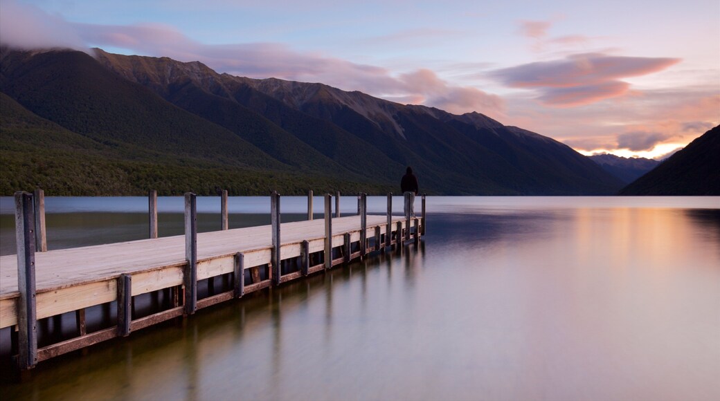 Nelson Lakes National Park which includes mountains, a sunset and a bay or harbor