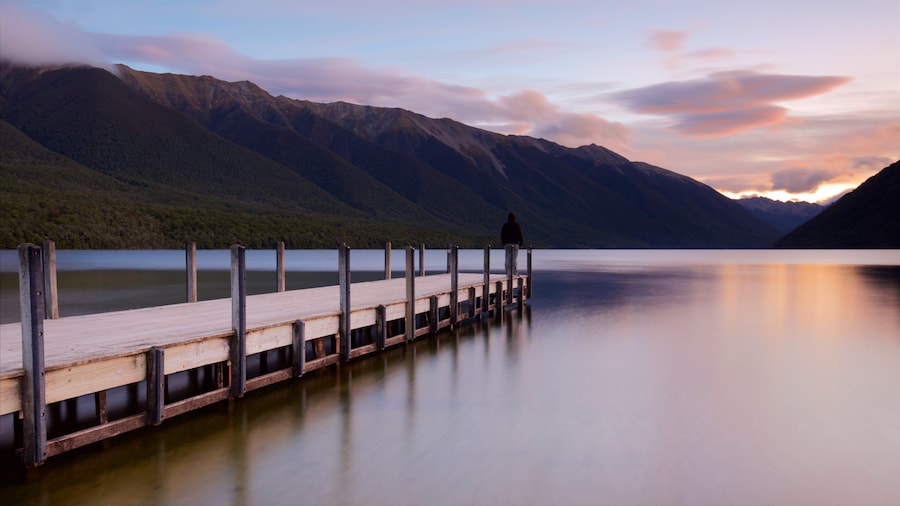 Nelson Lakes National Park which includes mountains, a sunset and a bay or harbor