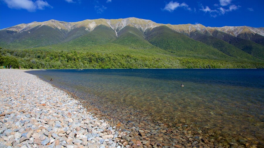 Nelson Lakes National Park showing mountains, a bay or harbor and a pebble beach