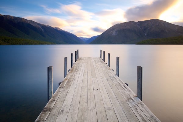 Nelson Lakes National Park featuring mountains, a sunset and a bay or harbor