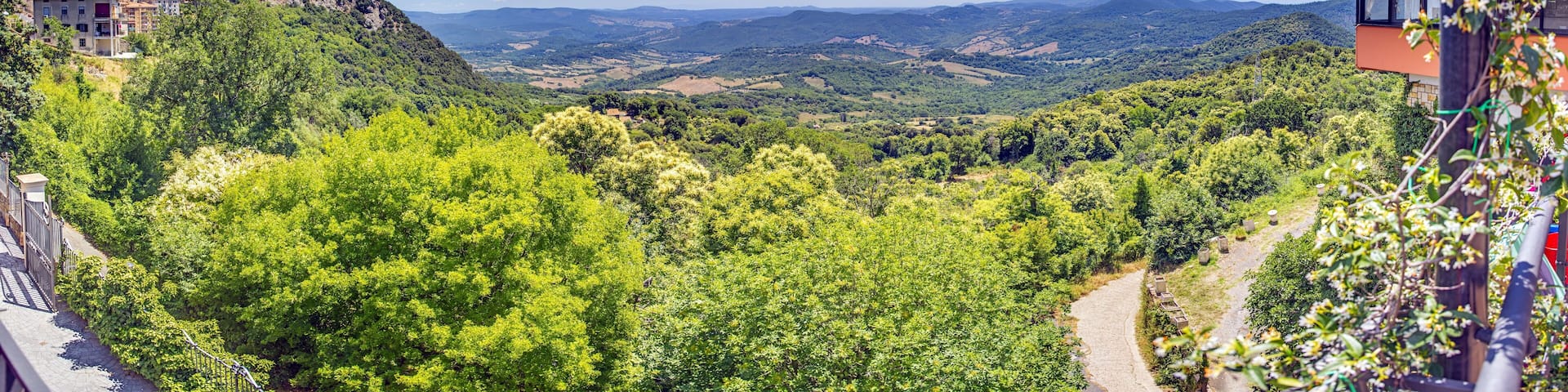 Panoramic view of the Italian town of Tolfa over the surrounding mountains during the day