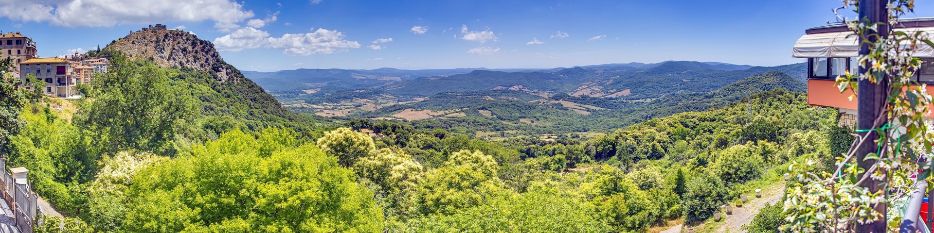 Panoramic view of the Italian town of Tolfa over the surrounding mountains during the day