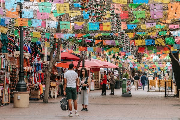 Market Square which includes street scenes and markets as well as a family