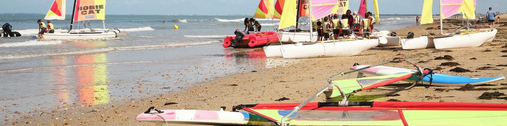 Windsurfing and sailing at Plage de la Braie.