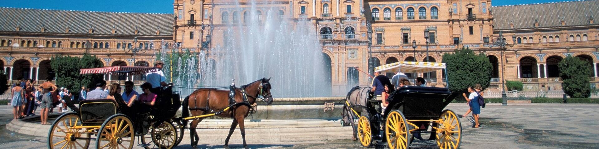 Horse drawn carriage in front of a building, Plaza de Espana Square, Seville, Spain