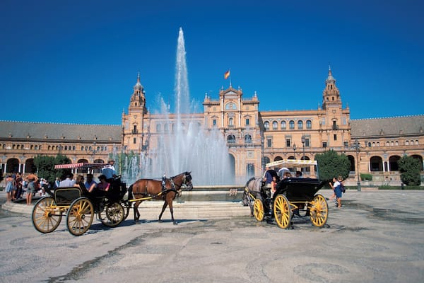Horse drawn carriage in front of a building, Plaza de Espana Square, Seville, Spain