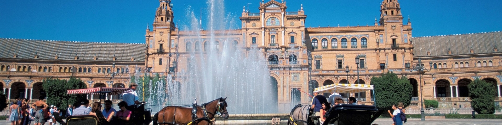 Horse drawn carriage in front of a building, Plaza de Espana Square, Seville, Spain