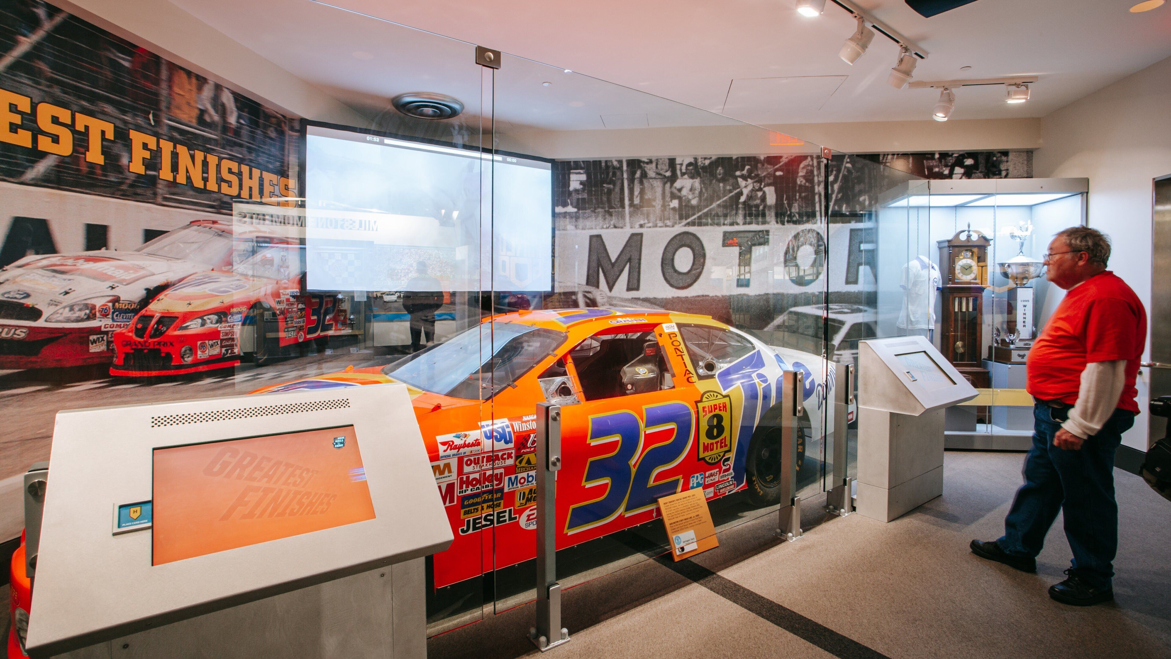 NASCAR Hall of Fame featuring interior views as well as an individual male