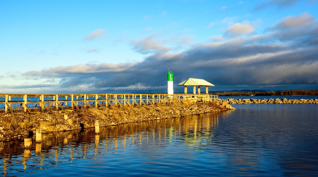 The Ottawa River in the first light of the morning seen from the Pembroke Marina in fall with a seawall and safe channel marker room for text