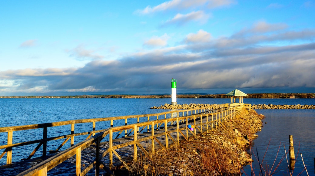 The Ottawa River in the first light of the morning seen from the Pembroke Marina in fall with a seawall and safe channel marker room for text