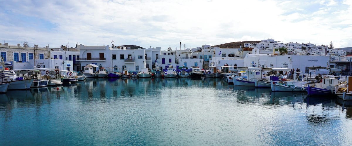 A harbor with white buildings and boats.