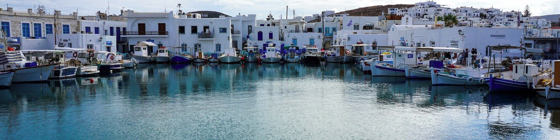 A harbor with white buildings and boats.