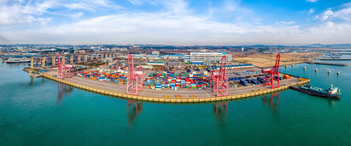 Manho-ri, Pyeongtaek-si, Gyeonggi-do, South Korea - November 27, 2022: Aerial view of cranes and container swith a cargo ship moored at Pyeongtaek Port