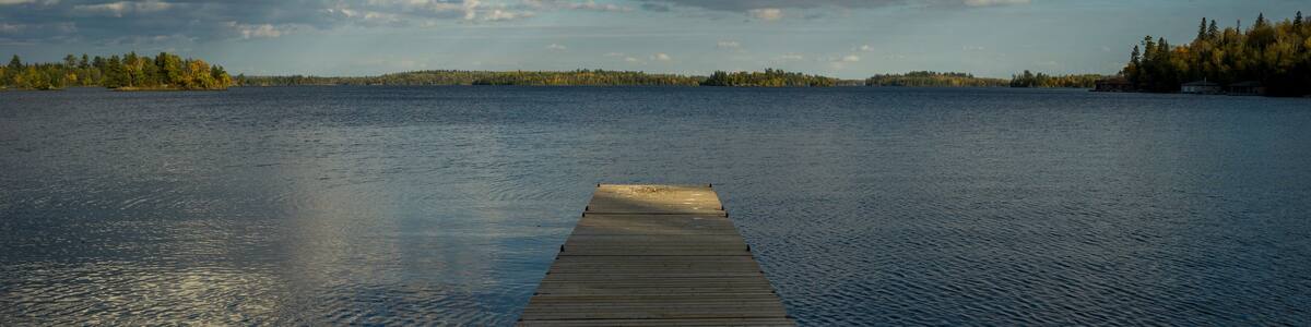 Wooden Dock in a lake, Kenora, Lake of The Woods, Ontario, Canada