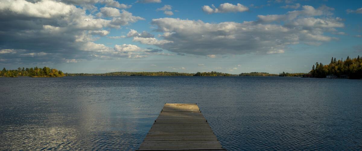 Wooden Dock in a lake, Kenora, Lake of The Woods, Ontario, Canada