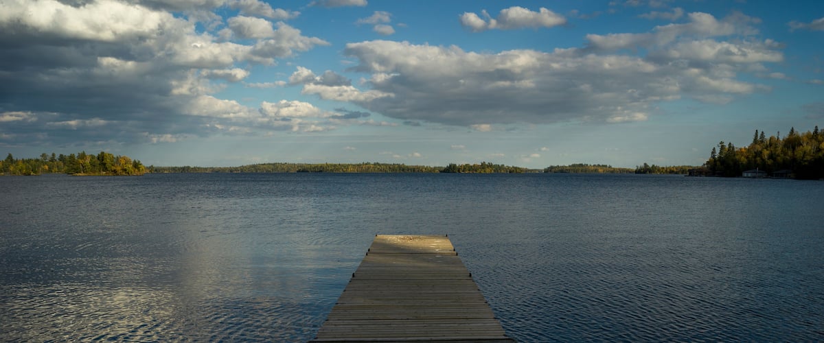 Wooden Dock in a lake, Kenora, Lake of The Woods, Ontario, Canada