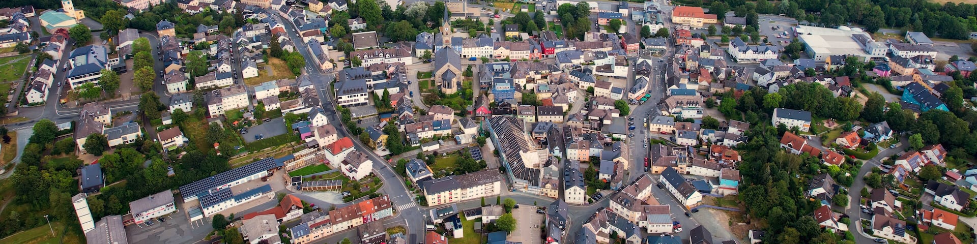 Aerial view around the old town in the city Naila on an cloudy spring day in Germany