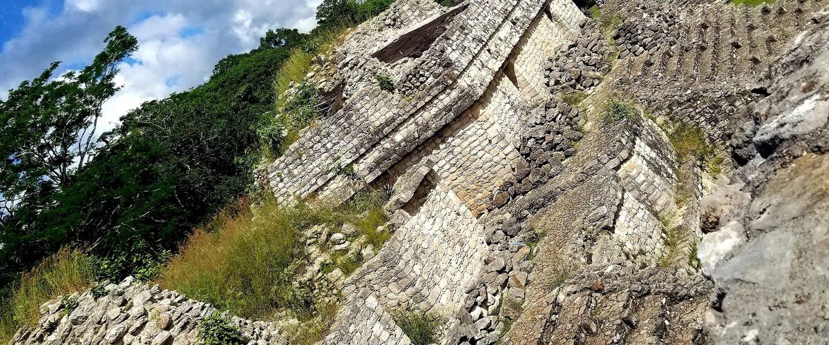 Ek Balam, now a protected ecological site in Mexico, was a predominant Mayan city between 550 AD and 850 AD with 12,000 inhabitants. The Acropolis, formerly a place of knowledge and learning, shown in the distance, features 106 steps to its peak.
