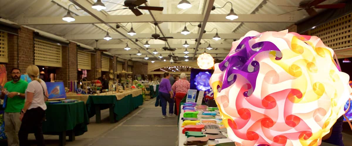 Charleston City Market which includes markets and interior views as well as a small group of people