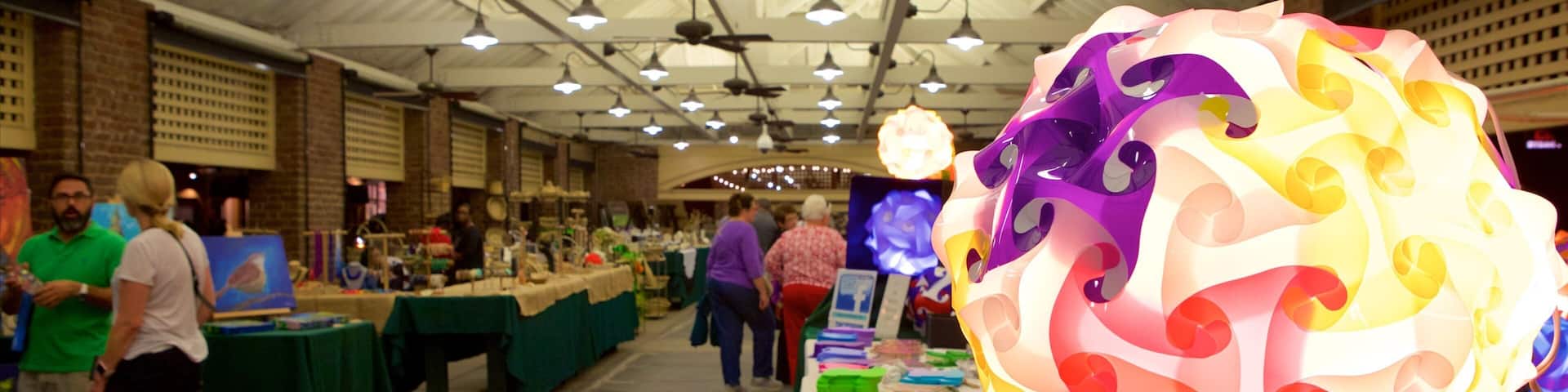 Charleston City Market which includes markets and interior views as well as a small group of people