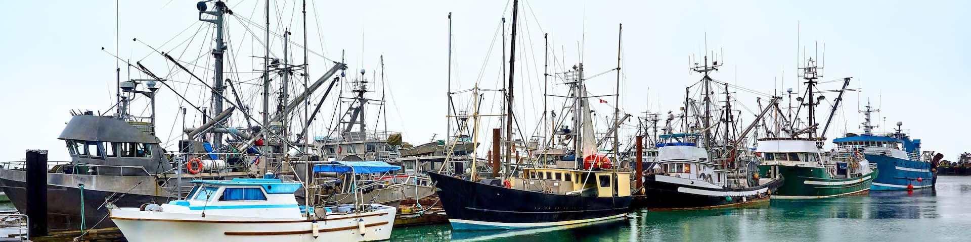 Fishing boats in Steveston harbor. Waterfront Steveston Fisherman's Wharf. Richmond, BC, Canada