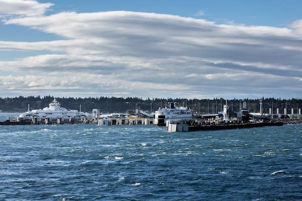 Passenger Ferry Terminal with two large ferry ships in windy weather and stormy at a background of stormy sky, Vancouver, BC, Canada