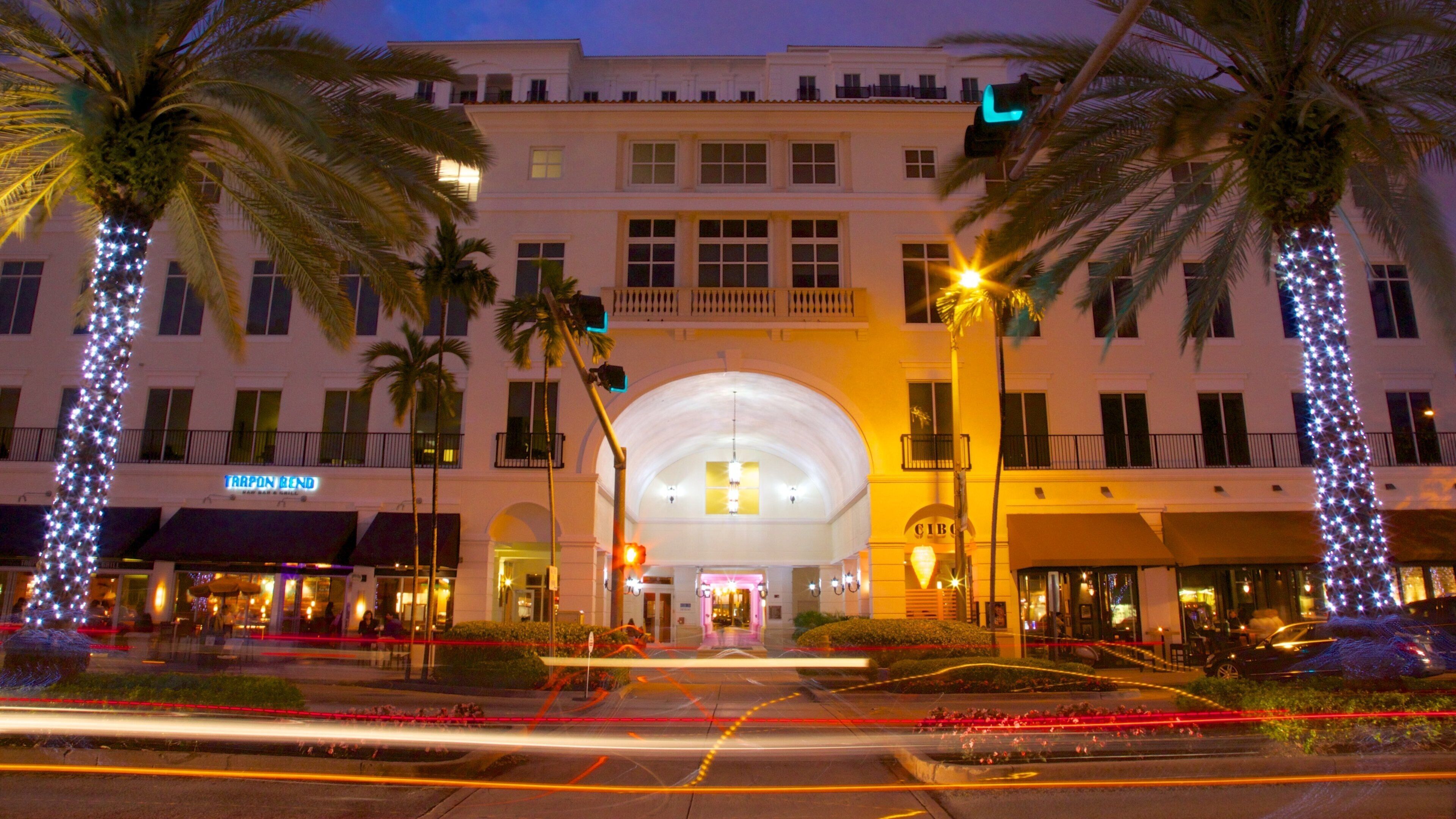 Vibrant Miracle Mile in Coral Gables showcasing festive lights and evening activity