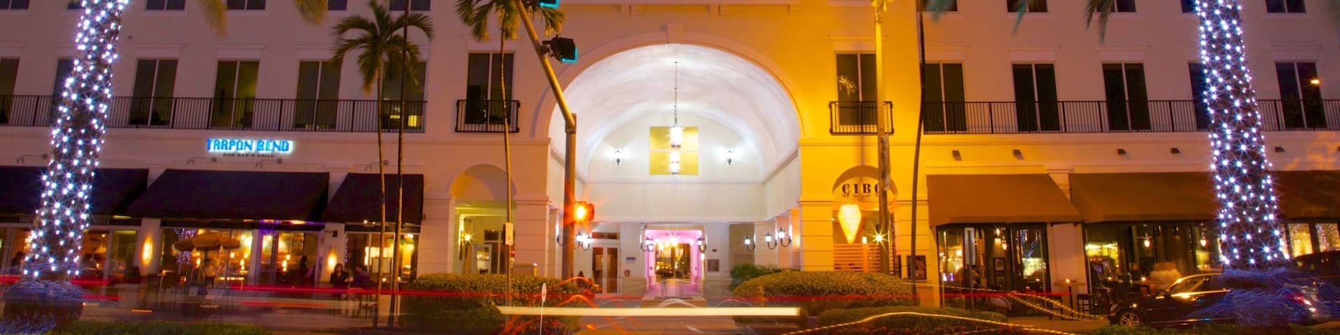 Vibrant Miracle Mile in Coral Gables showcasing festive lights and evening activity