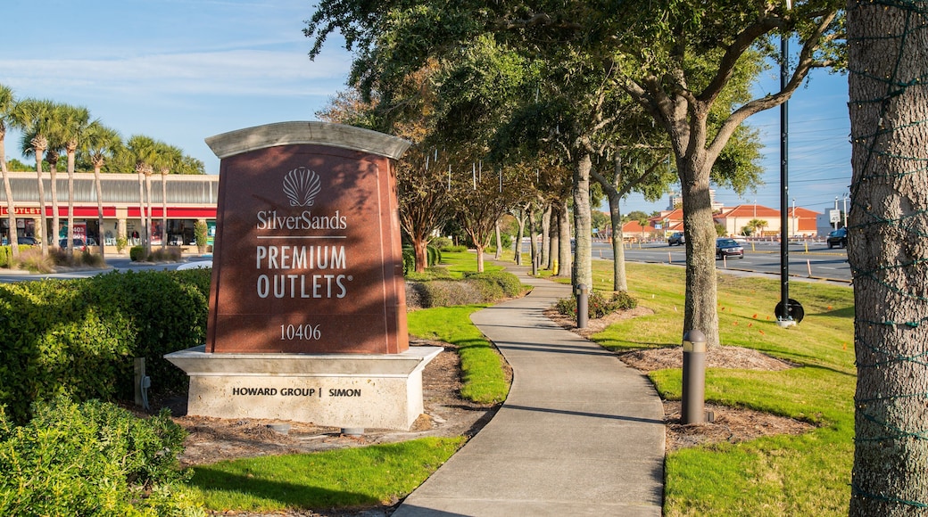 Silver Sands Premium Outlets which includes signage and a garden