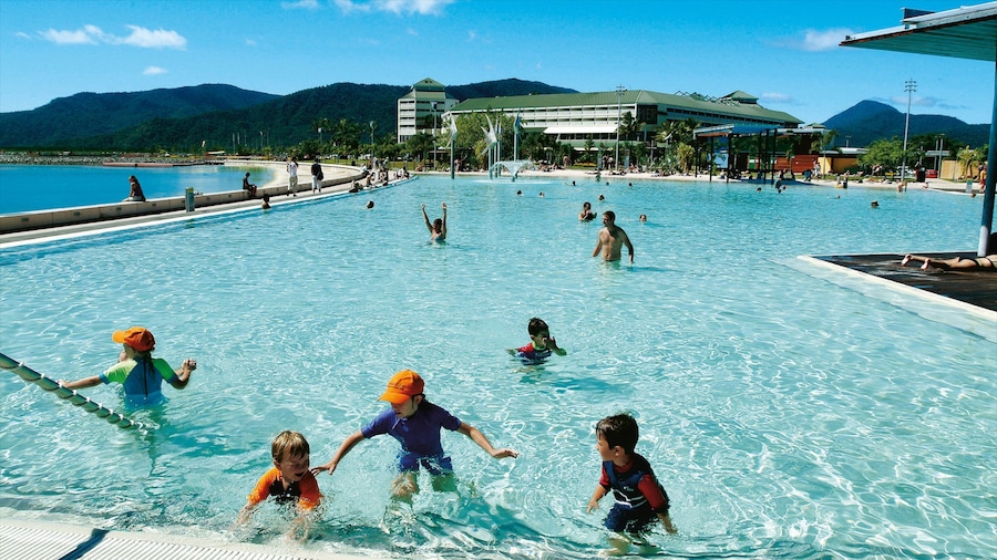 Cairns Esplanade showing a pool, a luxury hotel or resort and swimming
