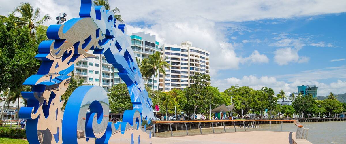 Cairns Esplanade featuring outdoor art and a bay or harbor