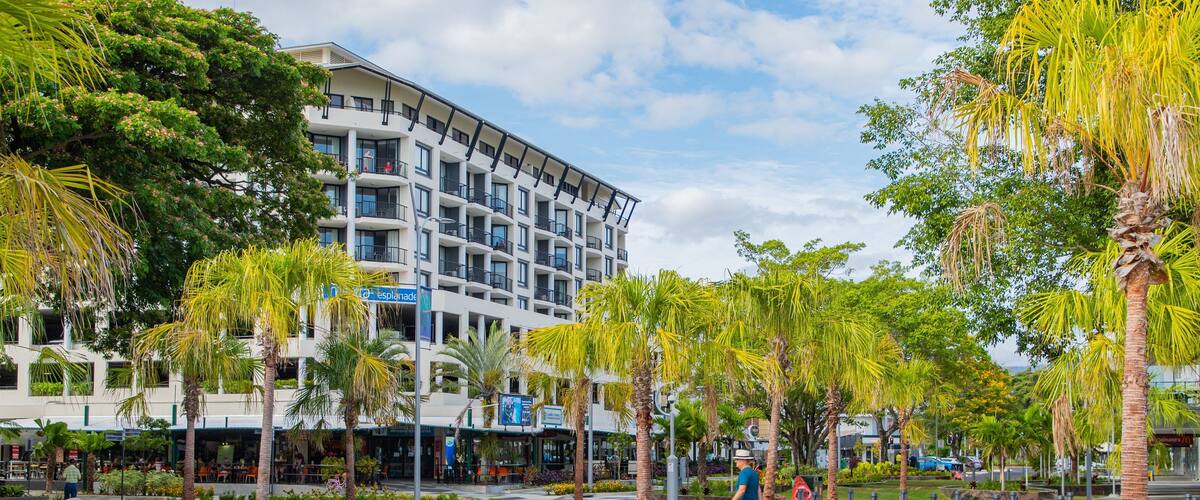 Cairns Esplanade which includes a square or plaza and street scenes as well as an individual male