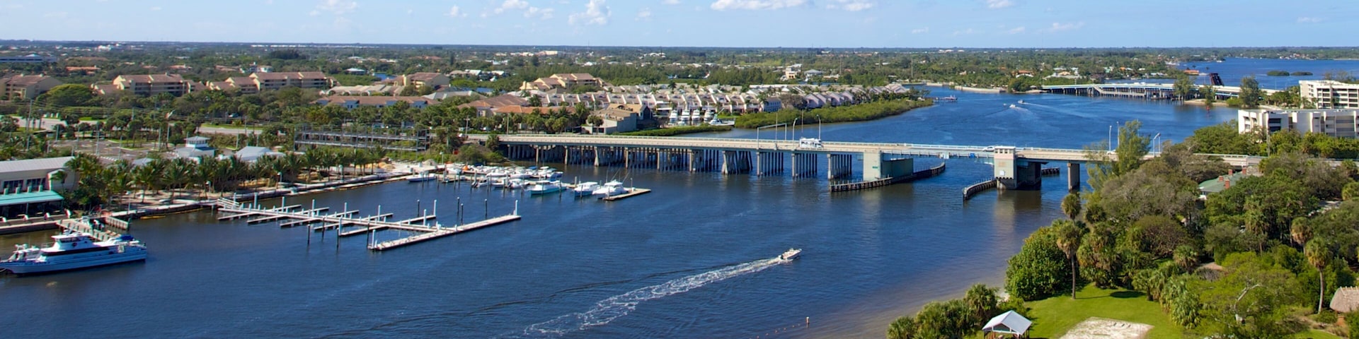 Jupiter Inlet Lighthouse showing a bay or harbor, general coastal views and a bridge