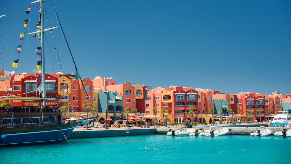panoramic seascape on colorful Marina promenade street from Red Sea with moored motor yachts. Marina, Hurghada, Egypt