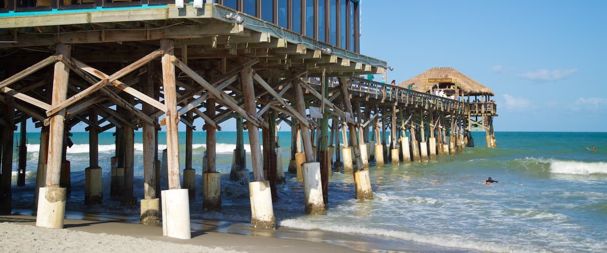 Cocoa Beach Pier which includes general coastal views and a sandy beach