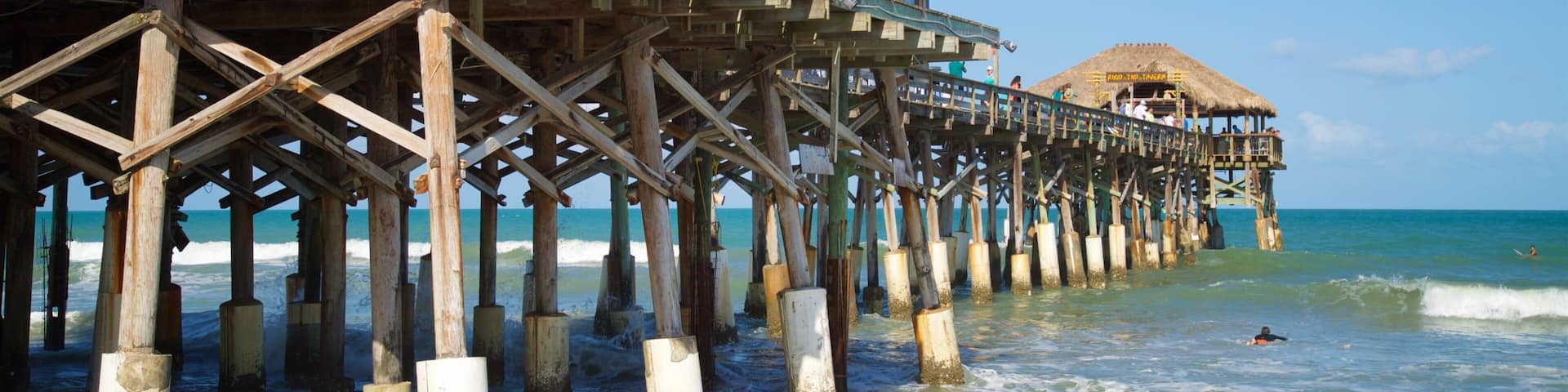 Cocoa Beach Pier which includes general coastal views and a sandy beach